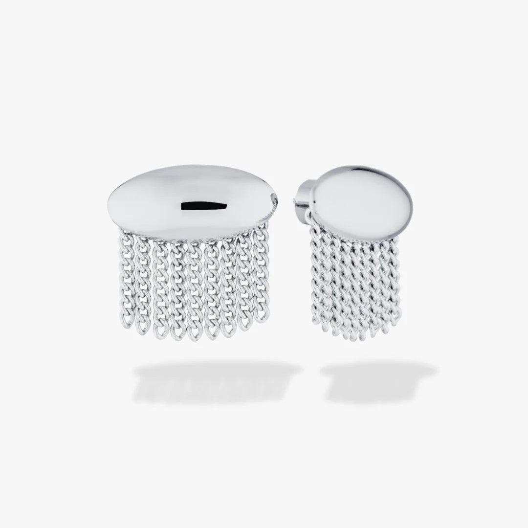 A pair of silver-toned studs with a circular top plate and dangling chain fringe, shown on a light grey background.